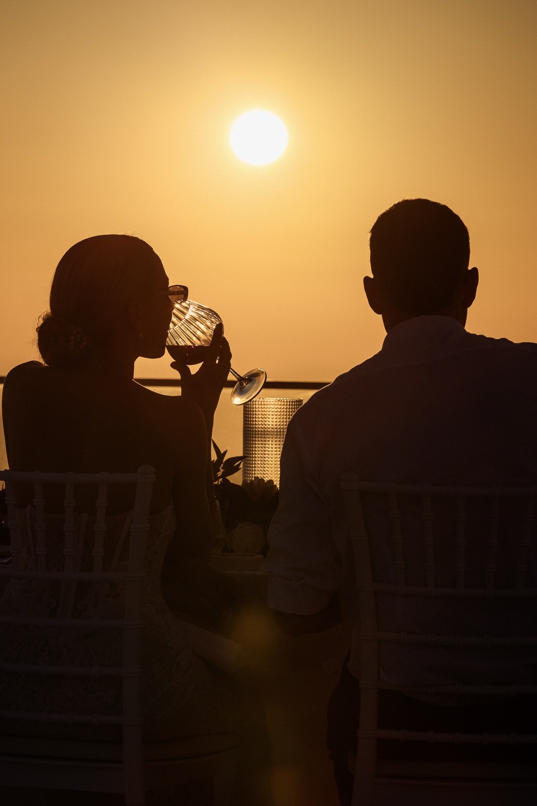 Santorini elopement photographer capturing golden hour light