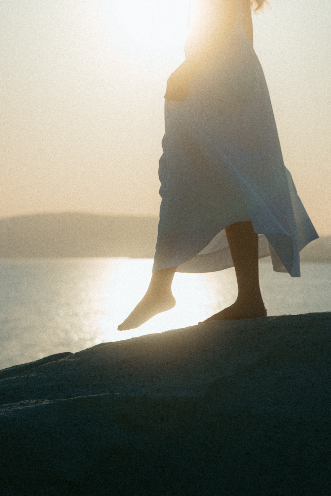 Couple at sunrise on Sarakiniko beach, photographed by a Milos photographer