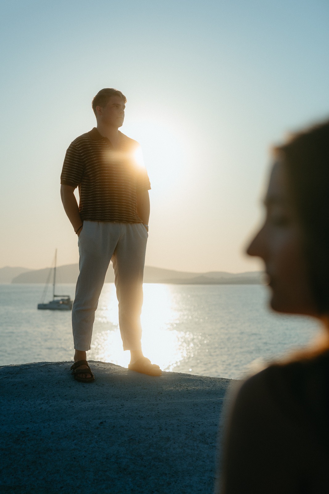 Couple at sunrise on Sarakiniko beach, photographed by a Milos photographer