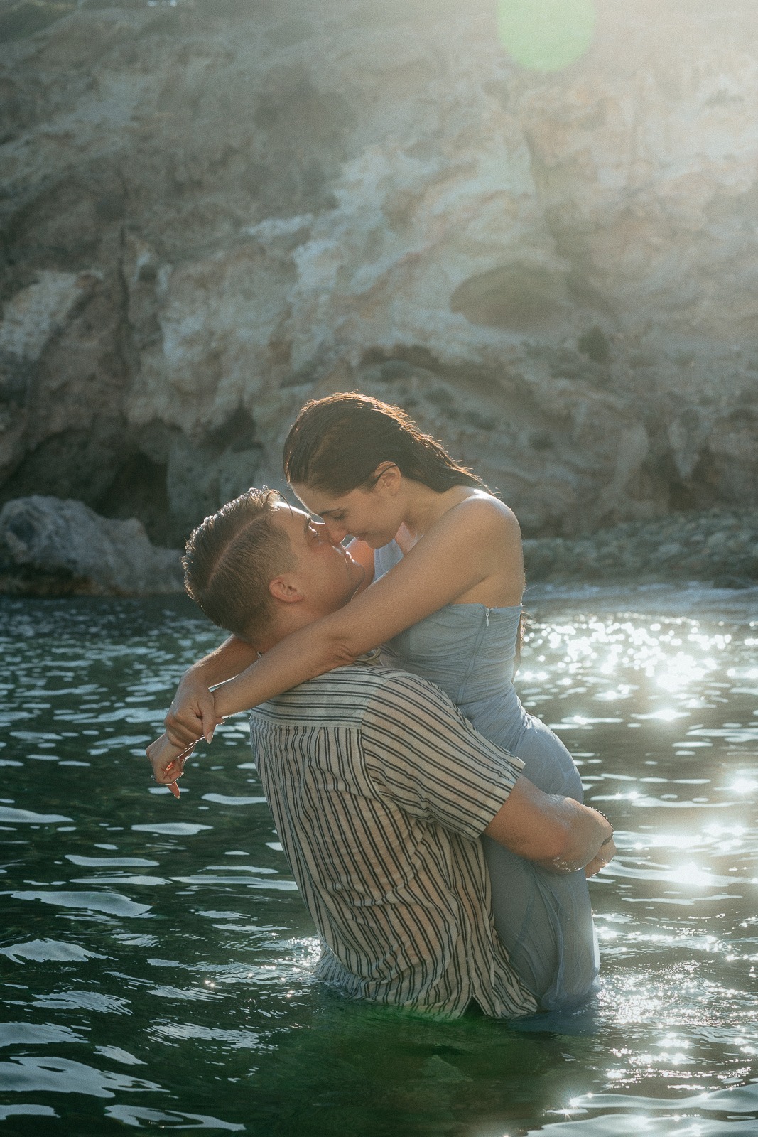 Couple at sunset on a secluded beach, photographed by a Milos photographer