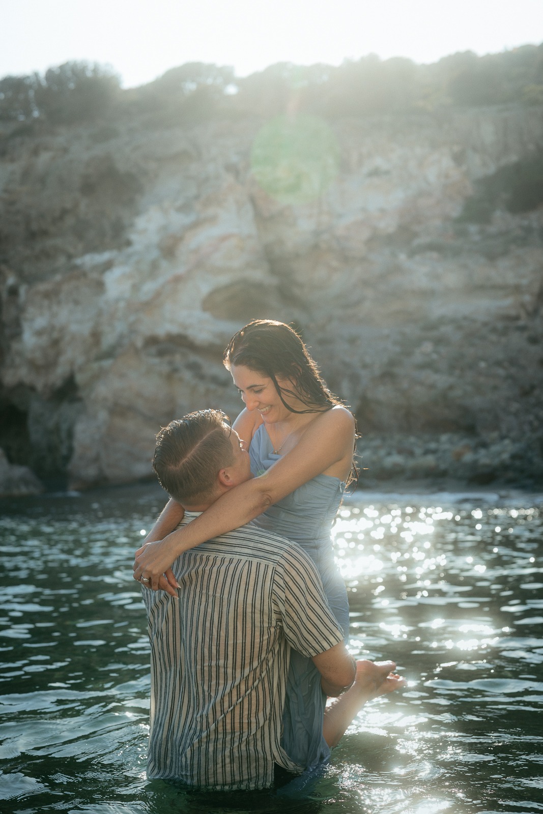 Couple at sunset on a secluded beach, photographed by a Milos photographer