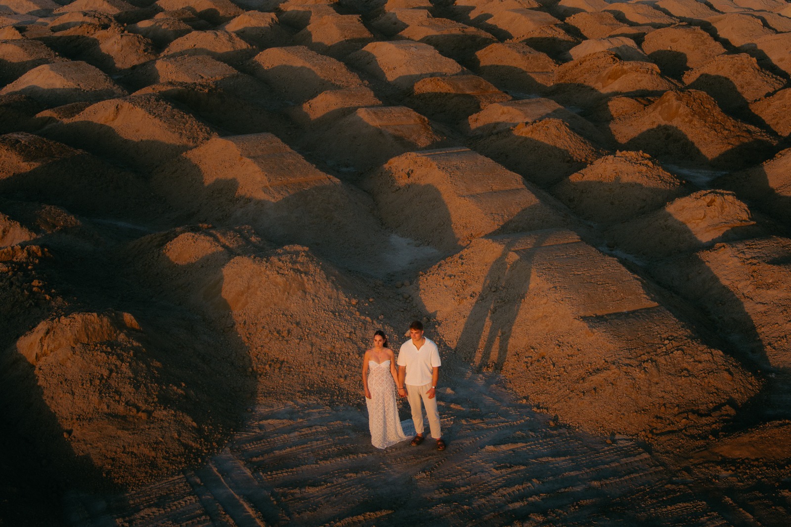 Couple at sunset on a secluded beach, photographed by a Milos photographer