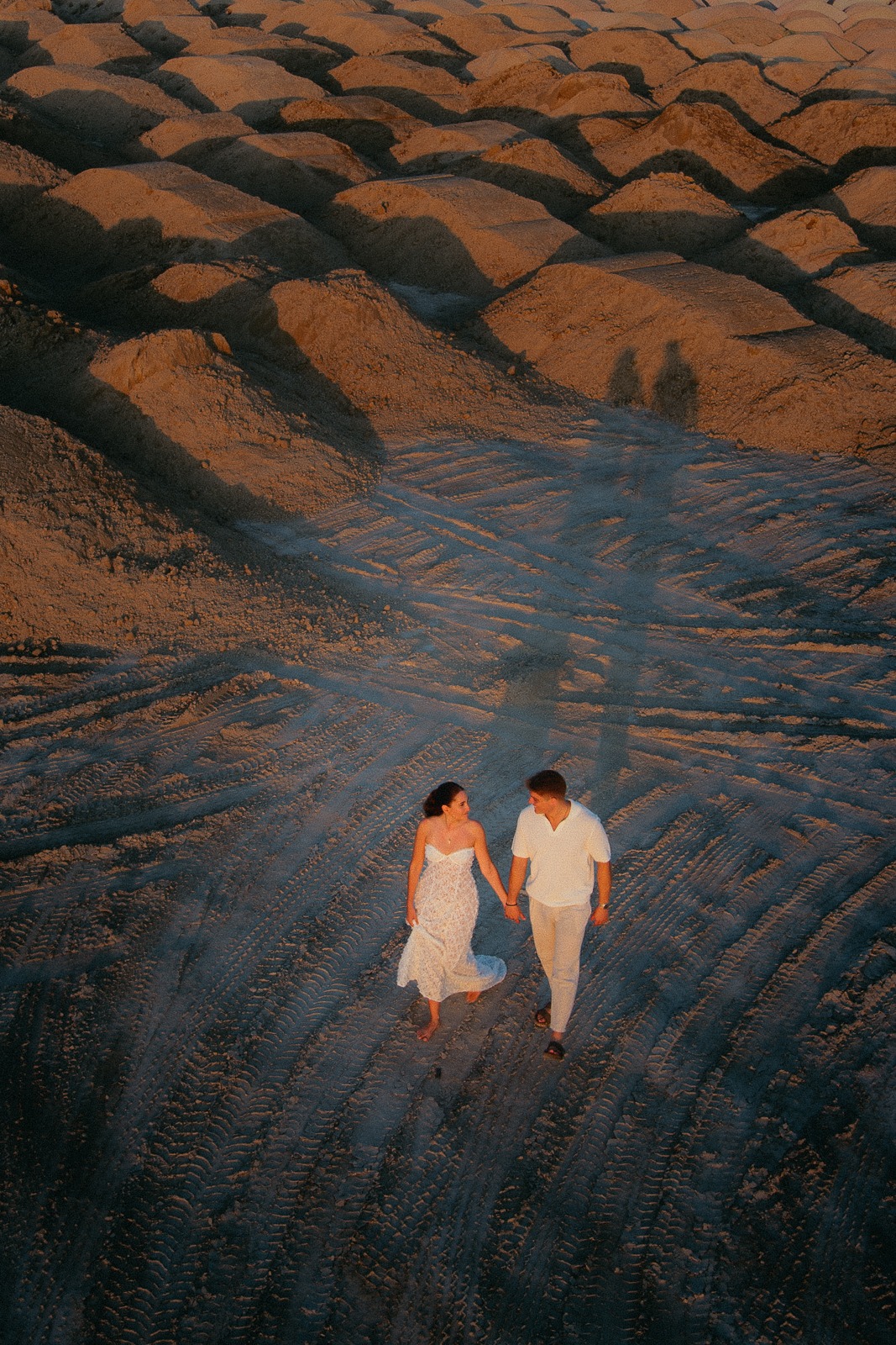 Couple at sunset on a secluded beach, photographed by a Milos photographer